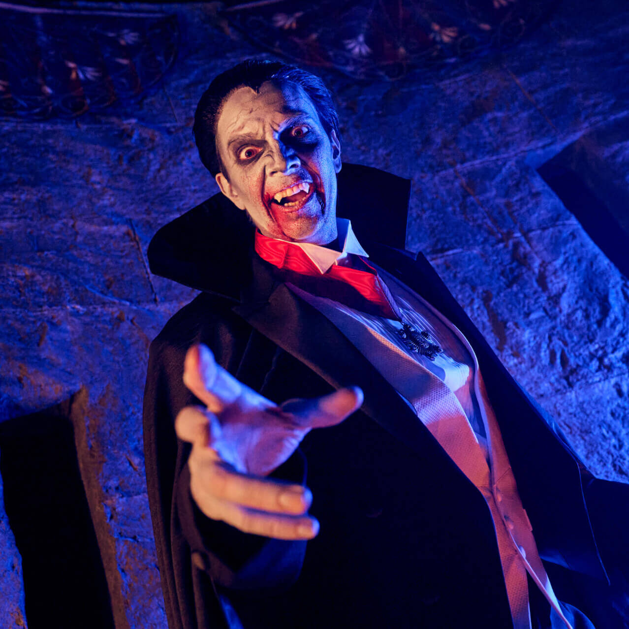 A character actor lunges forward, menacingly.