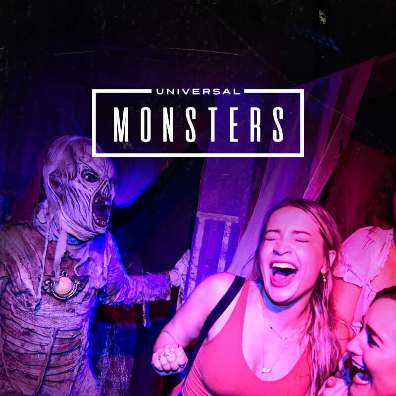 A promotional image for Universal Horror Unleashed featuring a terrifying mummy-like creature.  Universal Horror Unleashed logo in fiery red and silver letters, with the words "HYPE VIDEO" and a "Play" button.  