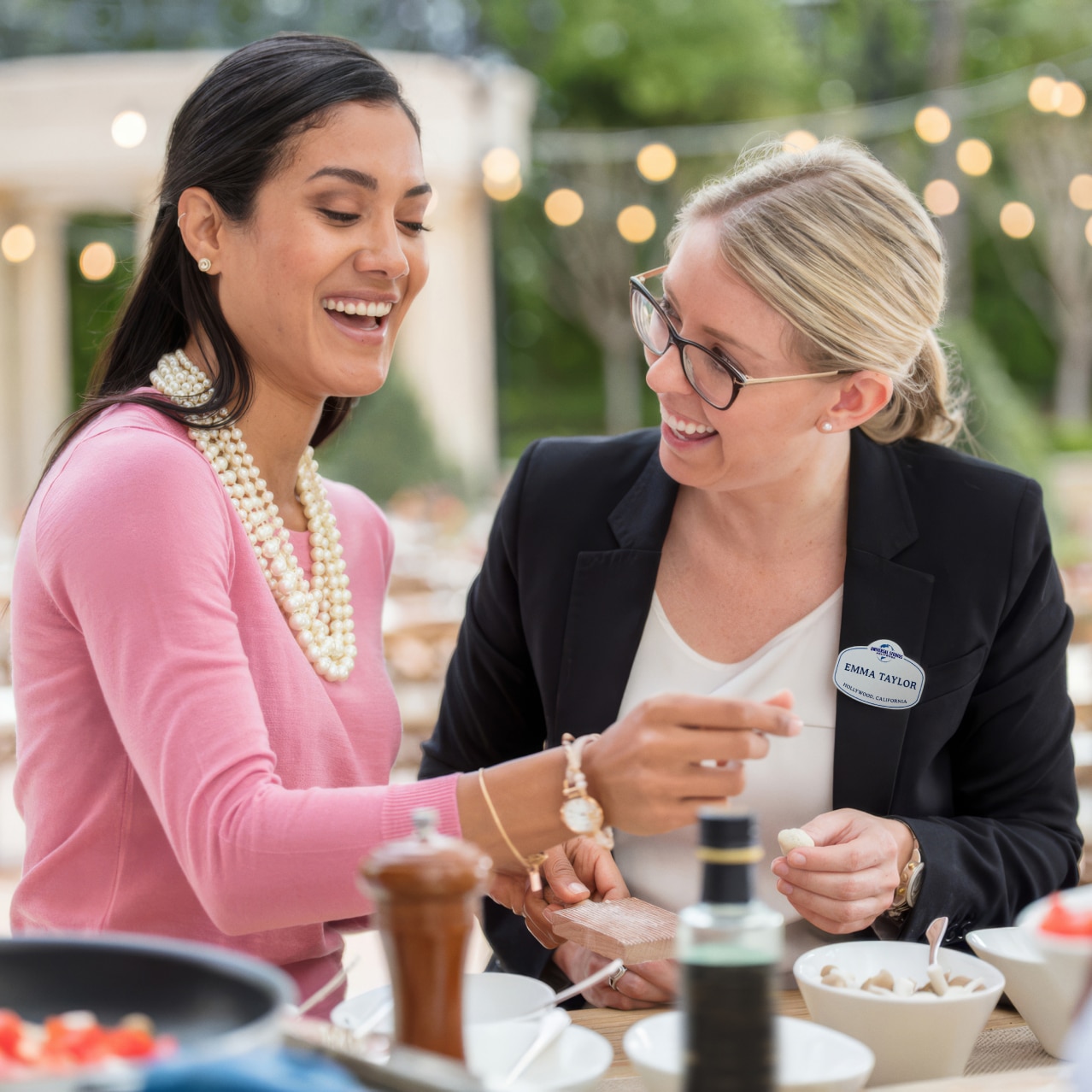 An Event Specialist chatting with a guest as they plan their event.