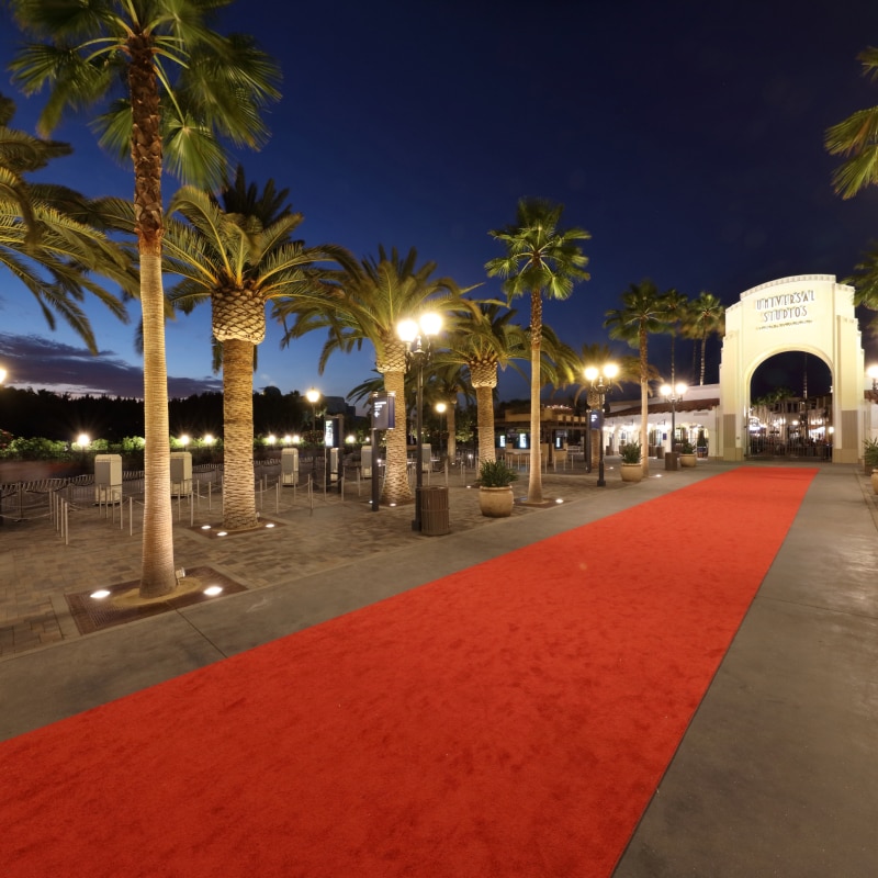 Red carpet leading up to the arch at the entrance to Universal Studios Hollywood.