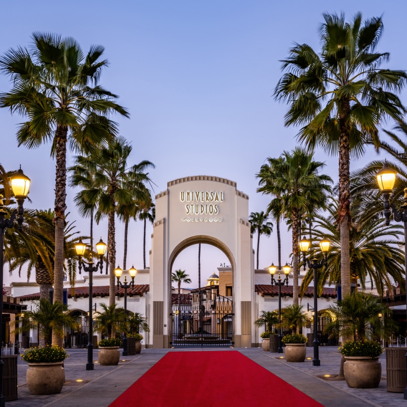 The red carpet leading up to the entrance arch at Universal Studios Hollywood.