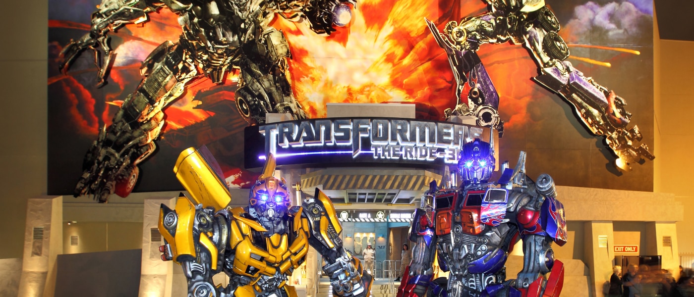 A nighttime view of the entrance to TRANSFORMERS: The Ride-3D.