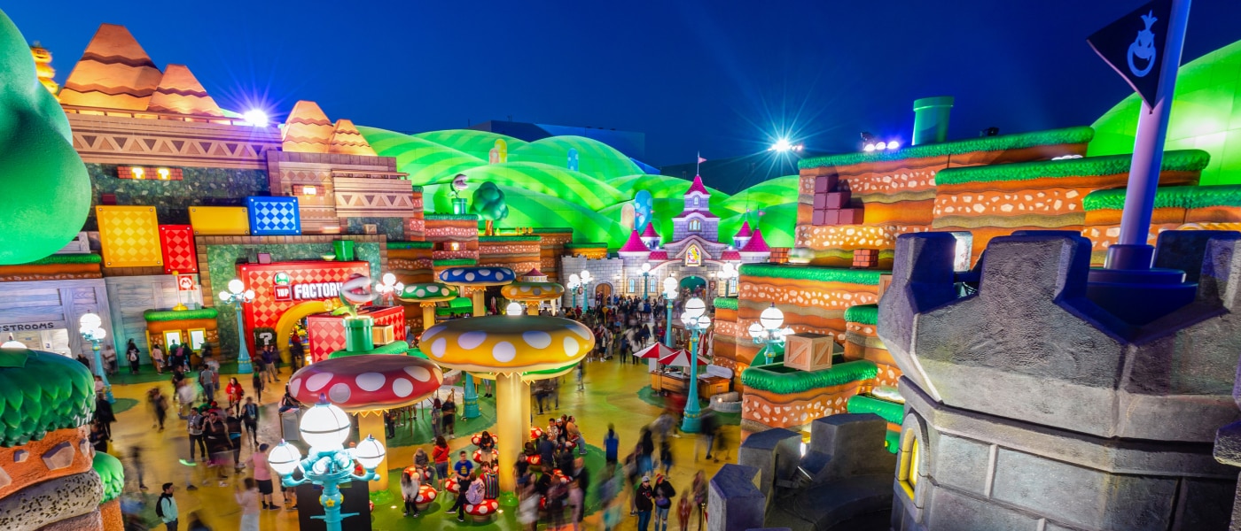 A nighttime view of SUPER NINTENDO WORLD™.