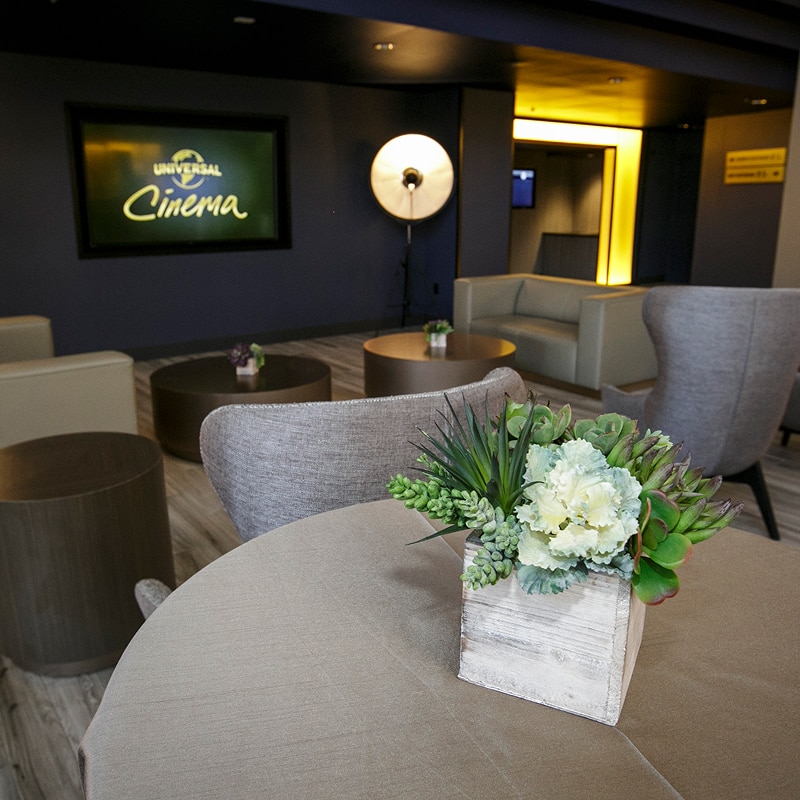 A table with flowers in a meeting area