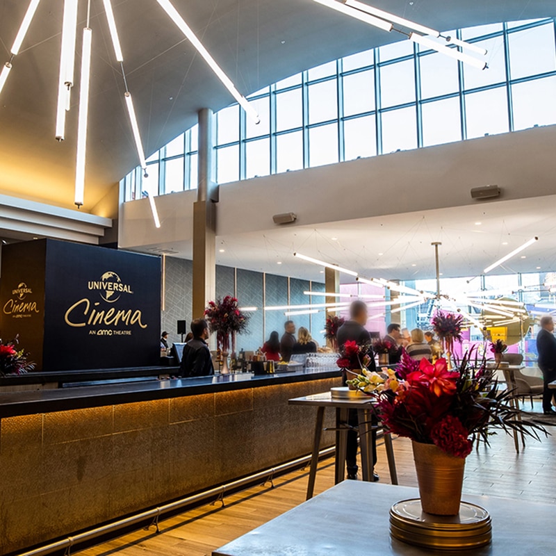 A long shot view of the bar and a meeting area at Universal Cinema