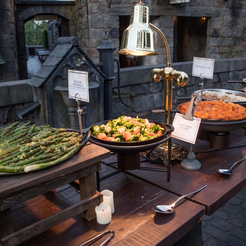 A buffet style spread for an event inside of Hogsmeade™ in The Wizarding World of Harry Potter.