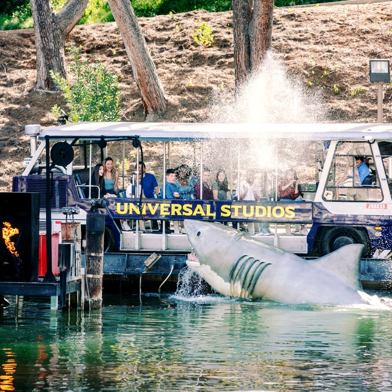 Jaws jumping out of the water as a tram full of guests passes through on The World Famous Studio Tour.