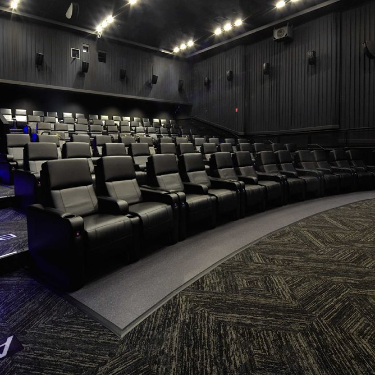 Empty rows of seats inside of a theater in Universal Cinema.