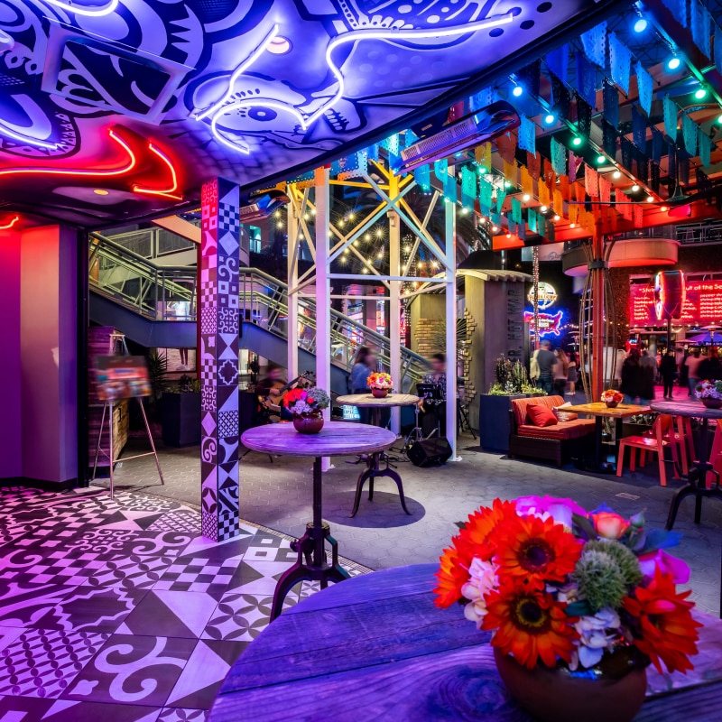 Neon lights in various colors accentuate an event space at Universal Studios Hollywood.