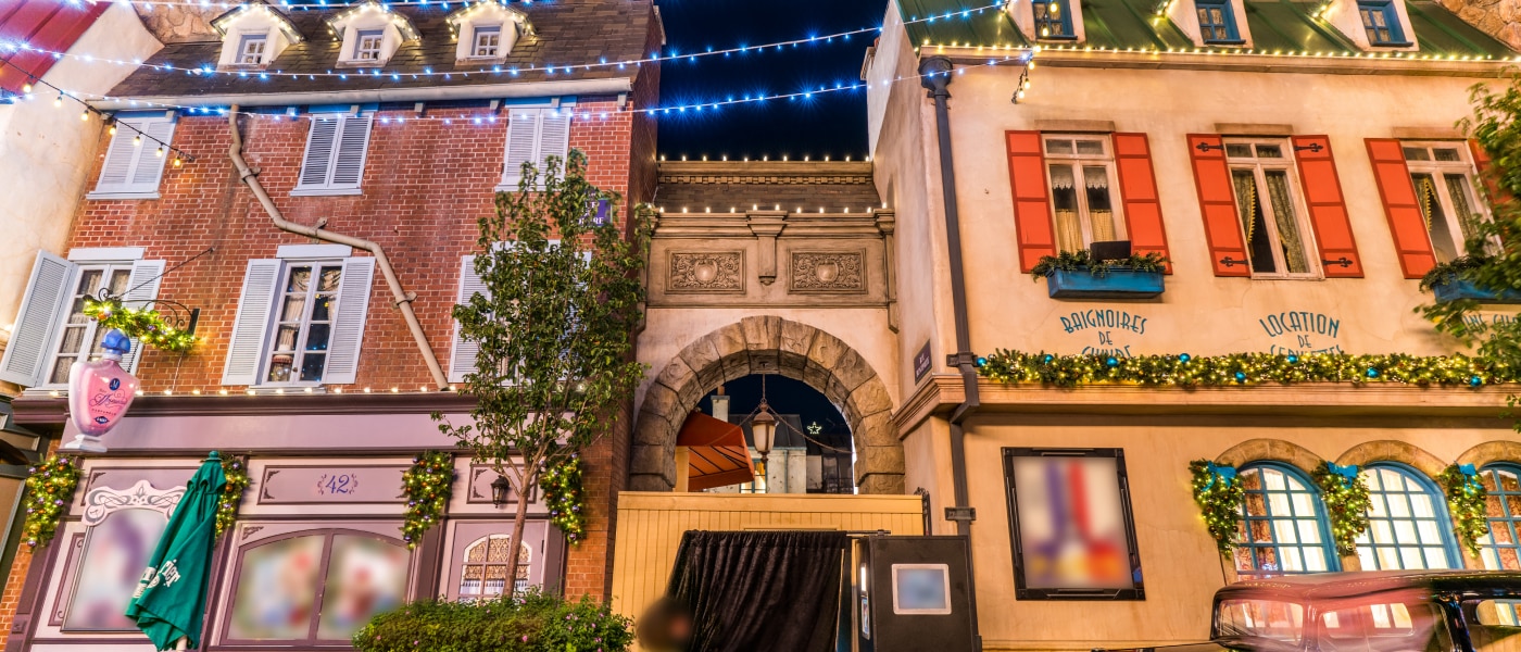 French Street at night with string lights hanging above inside Universal Studios Hollywood.