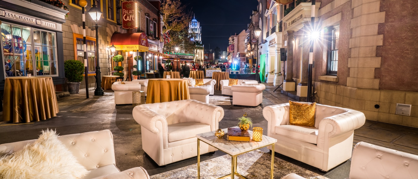 Couches and tables set up for an event at Minion Land inside Universal Studios Hollywood.