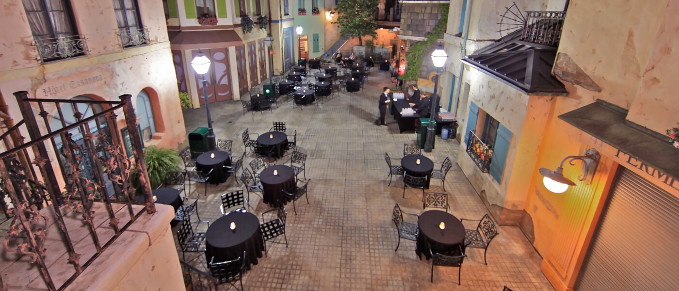 European-style streetscape event venue with outdoor tables and ambient lighting at Universal Studios Hollywood.