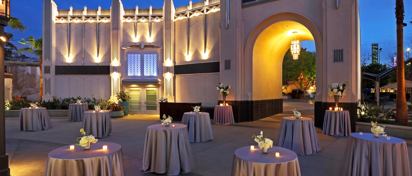 Universal Plaza event space with cocktail tables and elegant lighting at Universal Studios Hollywood.