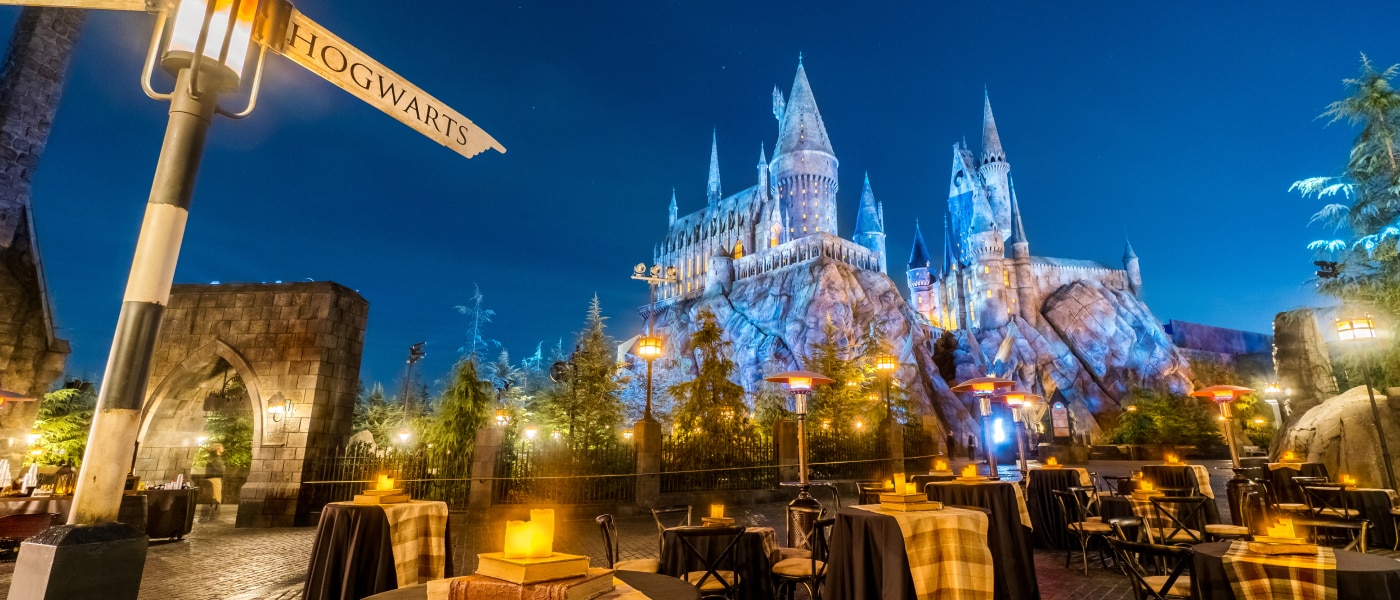 Hogwarts Castle at dusk inside of The Wizarding World of Harry Potter.