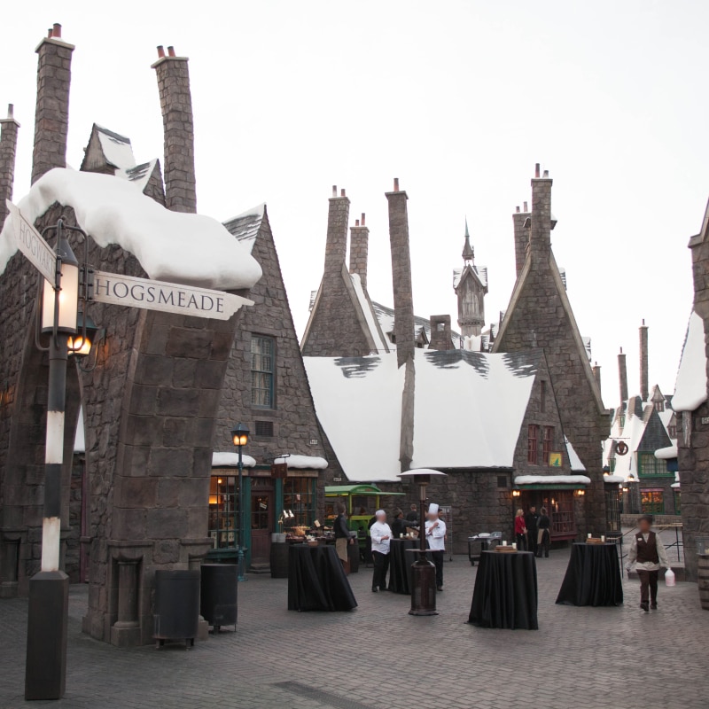 Tables set up for an inside of Hogsmeade™ in The Wizarding World of Harry Potter.