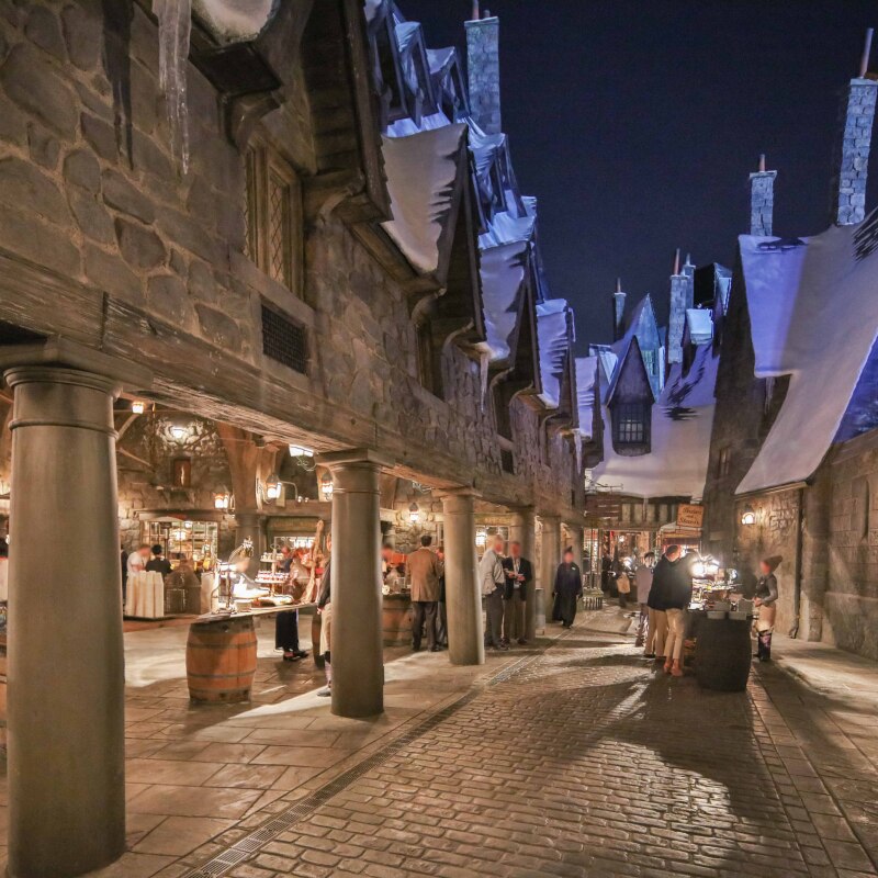 Guests enjoying a nighttime event inside of Hogsmeade™ in The Wizarding World of Harry Potter.