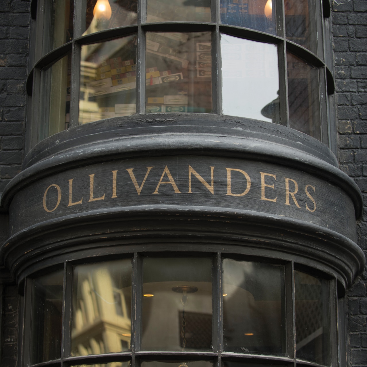 The word Ollivanders™ written above the store entrance.
