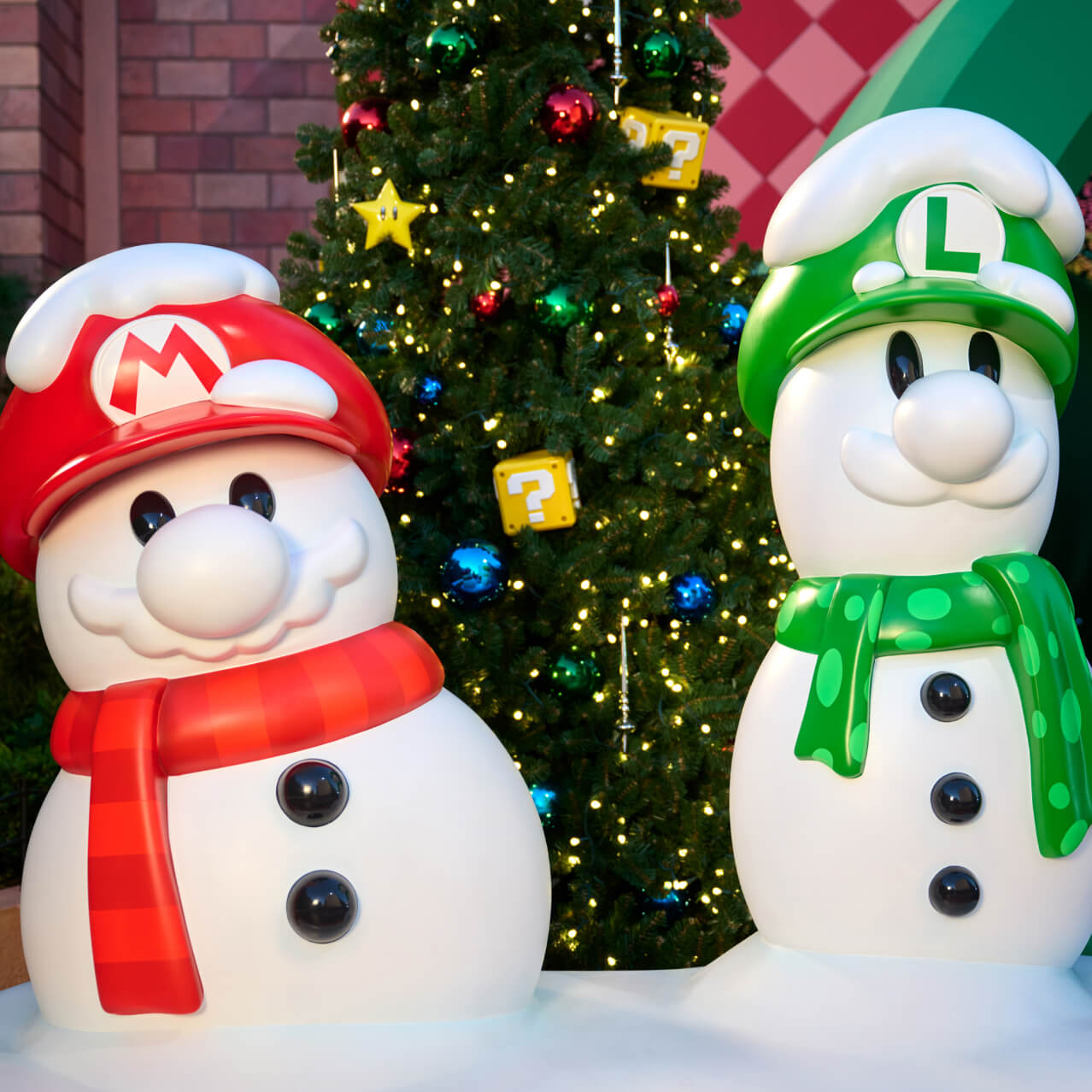 Mario and Luigi snowmen in front of a Christmas tree in SUPER NINTENDO WORLD at Universal Studios Hollywood.