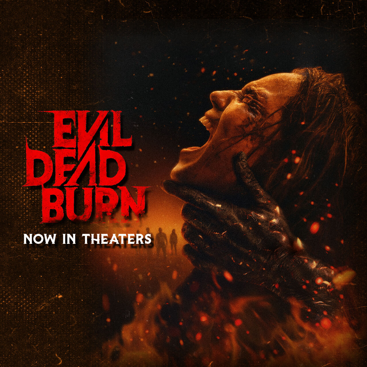 The Evil Dead Burn movie poster with a woman engulfed in flames as hands grip her neck and the text: Now in Theaters.