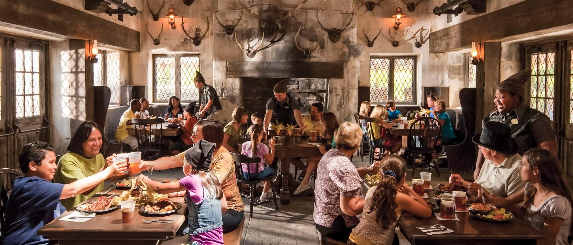 The restaurant Three Broomsticks with many families eating and drinking. Los Angeles, California