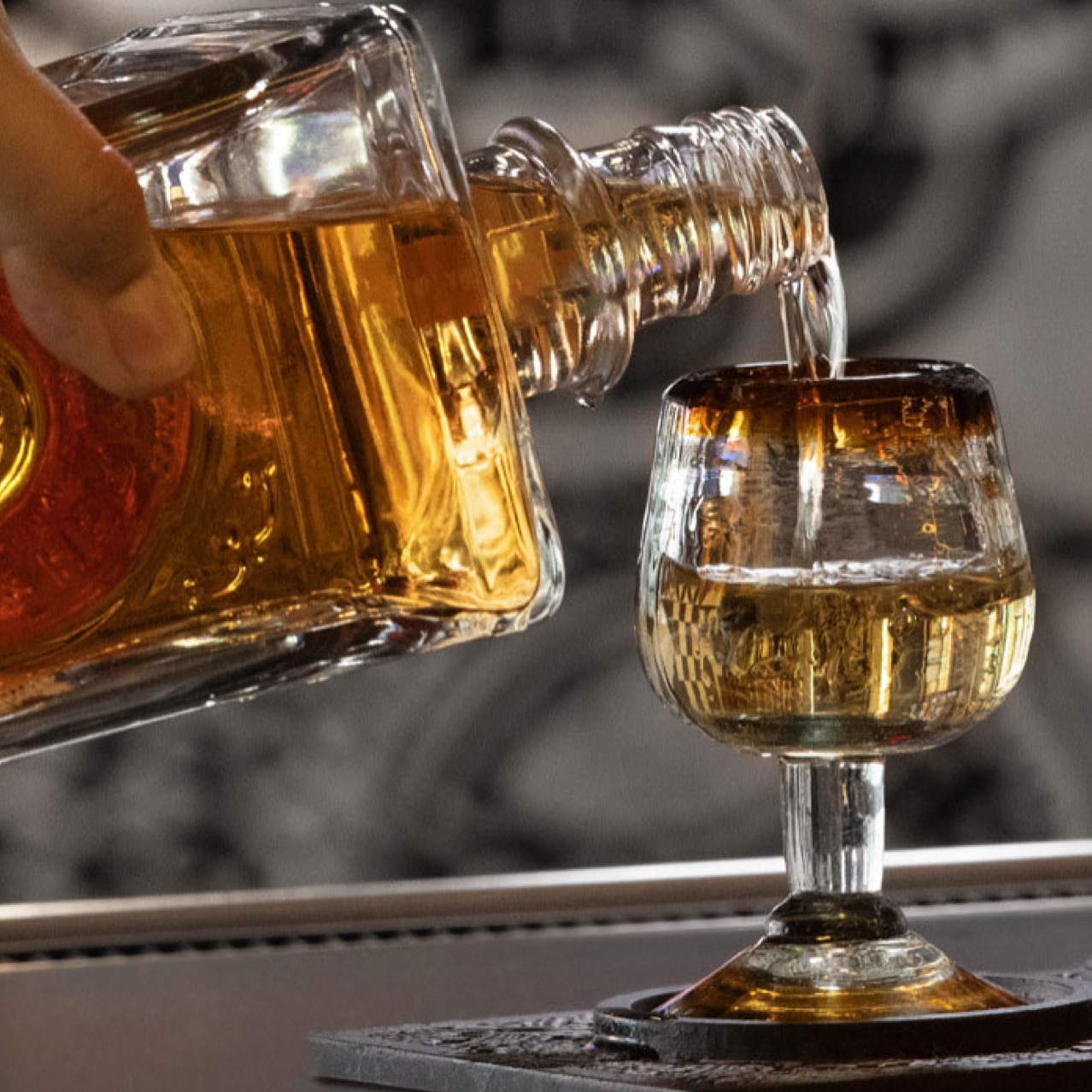 Tequila getting poured into glasses