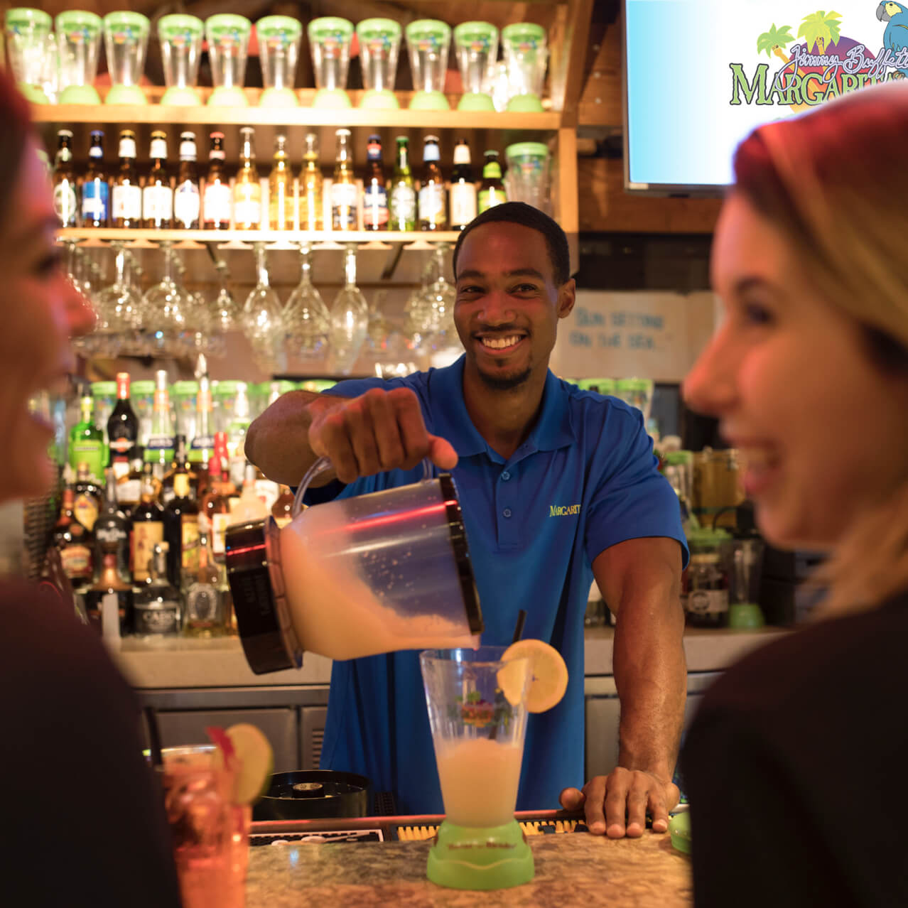 Bartender with guests at Margaritaville
