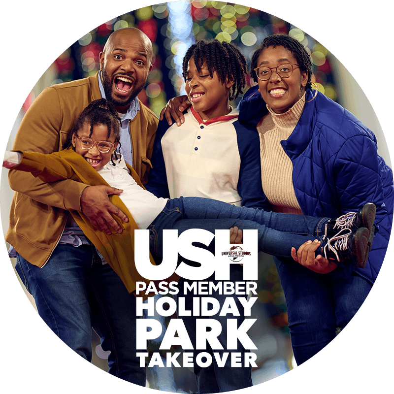 A family of four, three of them holding the youngest, enjoying Universal Studios Hollywood Pass Member Holiday Park Takeover.