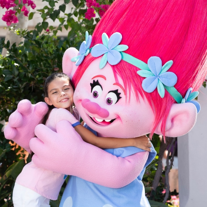 Character sightings, girl hugging poppy troll.