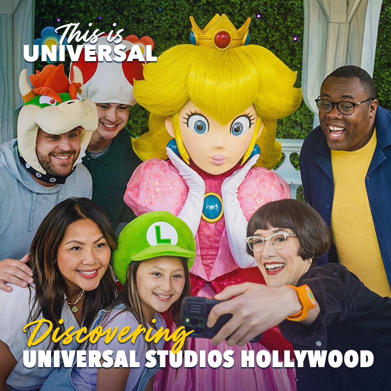 Princess Peach poses for a selfie with guests inside her gazebo in SUPER NINTENDO WORLD™ at Universal Studios Hollywood.