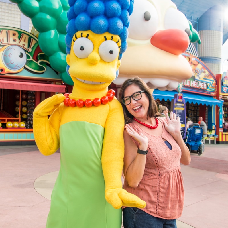 Marge Simpson and visitor pose for photo together