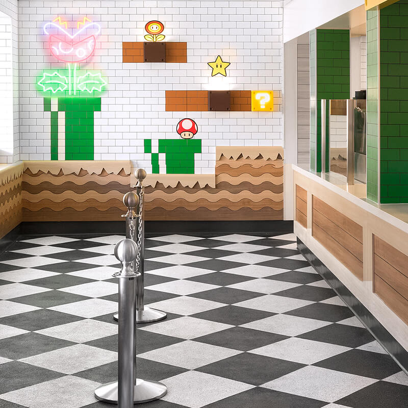Interior of the SUPER NINTENDO WORLD™ themed Power Up Cafe queue line at Universal Studios Hollywood.
