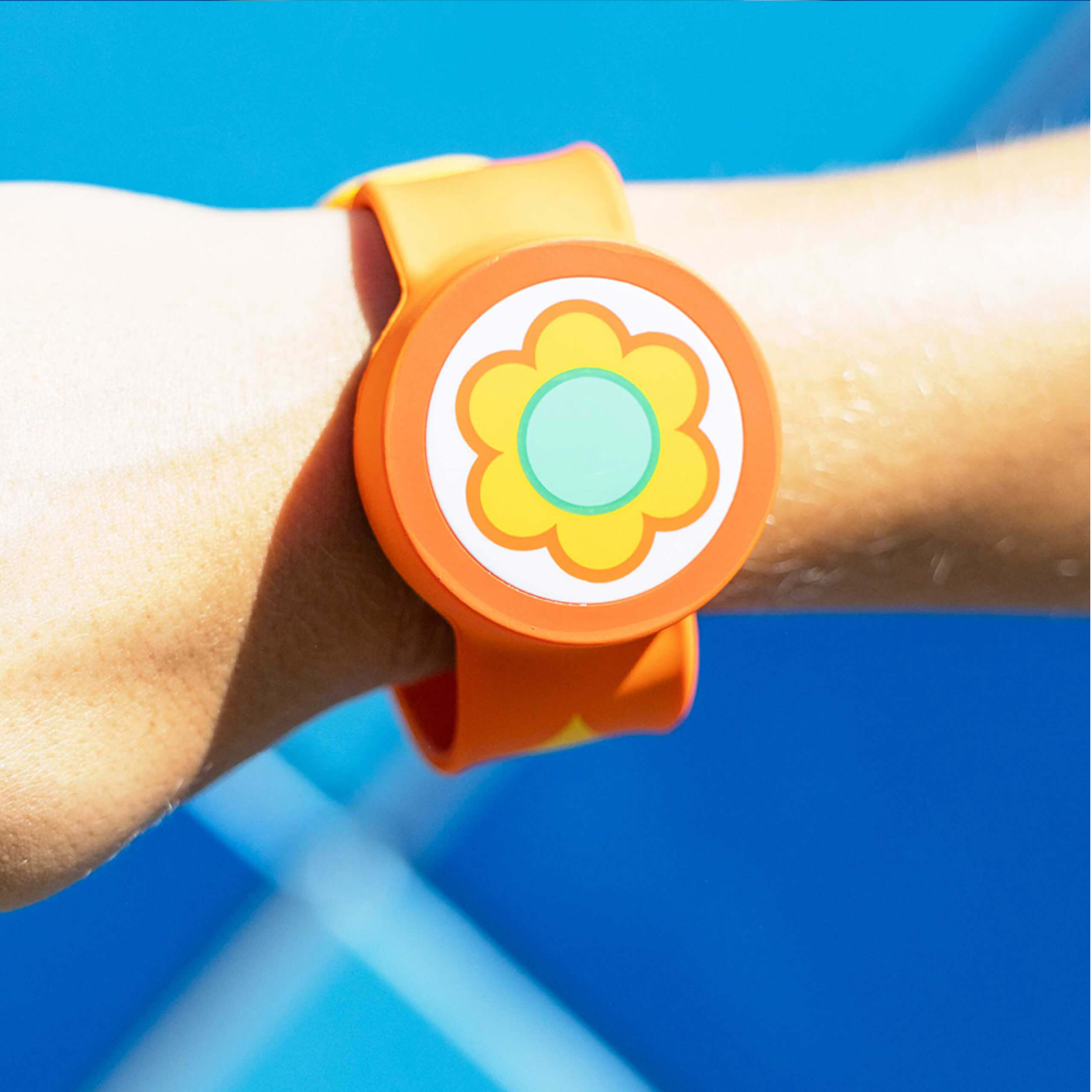An arm wearing a Power-Up Band on its wrist with an egg symbol representing the Super Mario character Yoshi.