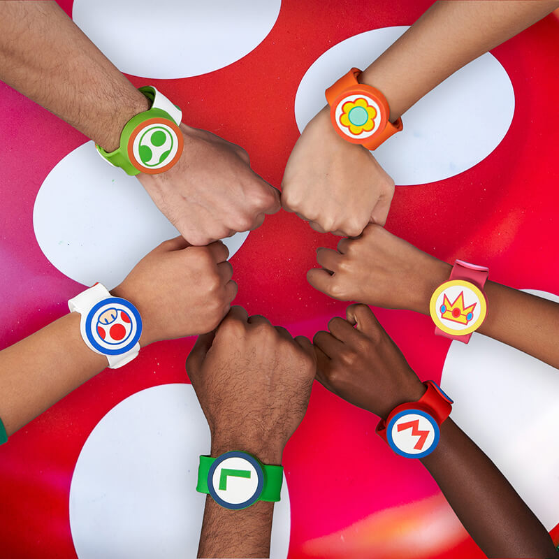 Six arms unite to reveal all the different Power-Up Bands above a mushroom.