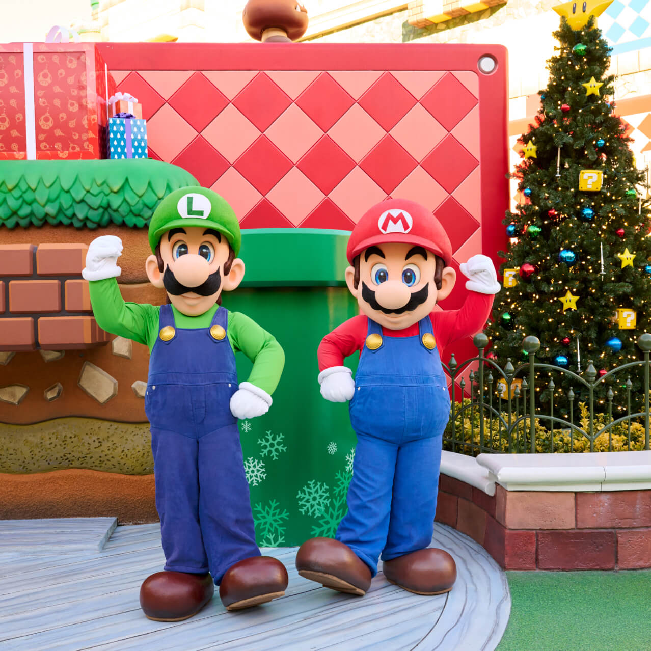 Mario and Luigi posing with a flexed foot and flexed arm.