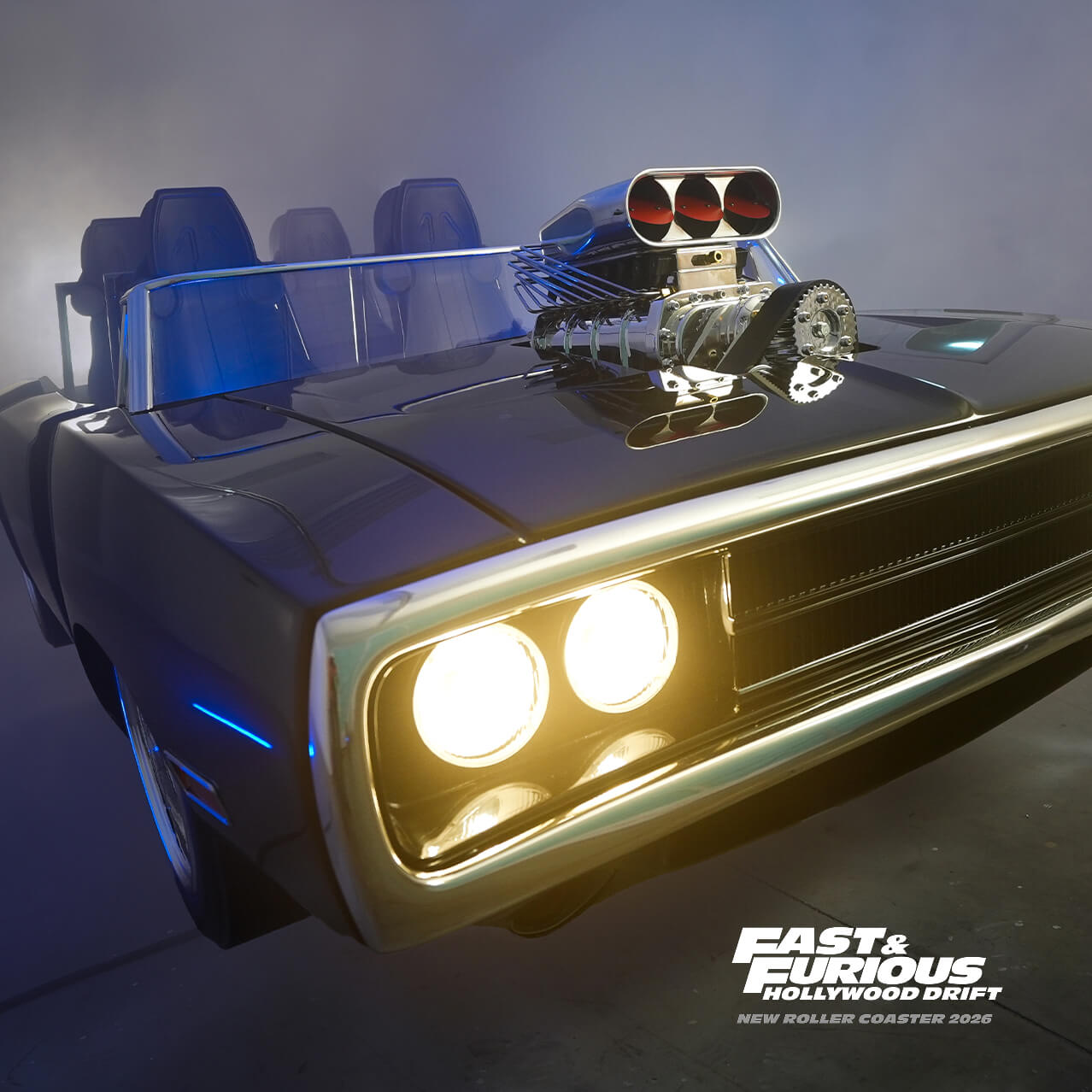 A black muscle car-style ride vehicle with white “FAST & FURIOUS HOLLYWOOD DRIFT” logo and “NEW ROLLER COASTER 2026” in gray.