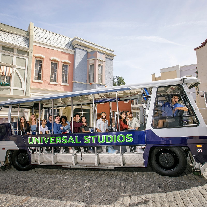 A conductor showcasing the Universal Studios Hollywood experience for a group of people