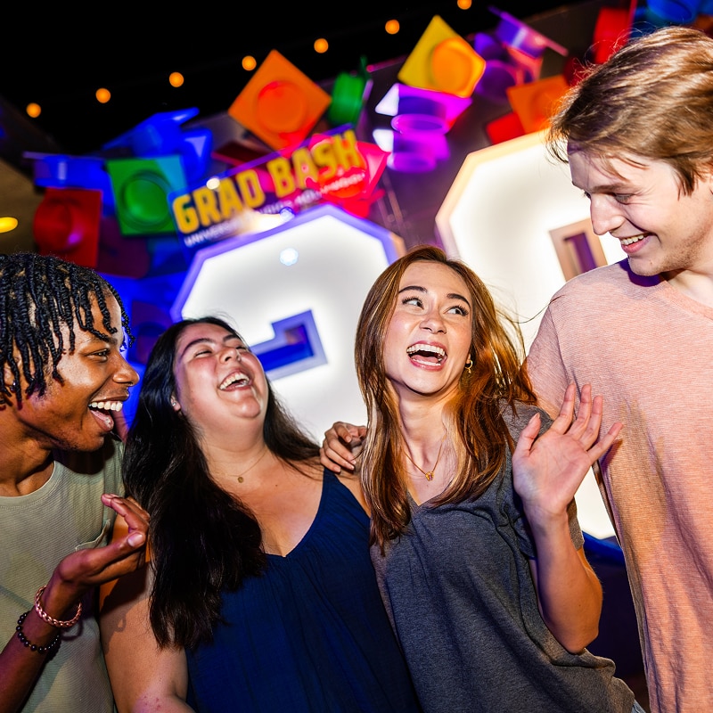 Group of teenagers smiling and having fun at Grad Bash
