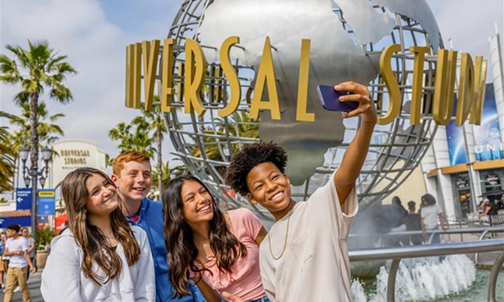 Kids taking a selfie in front of a castle at Universal Studios Hollywood