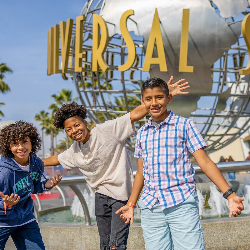 Kids posing in front of the Universal Studios Hollywood Globe