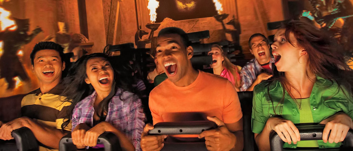 Group of riders showing excitement while riding the Revenge of the Mummy rollercoaster at Universal Studios Hollywood