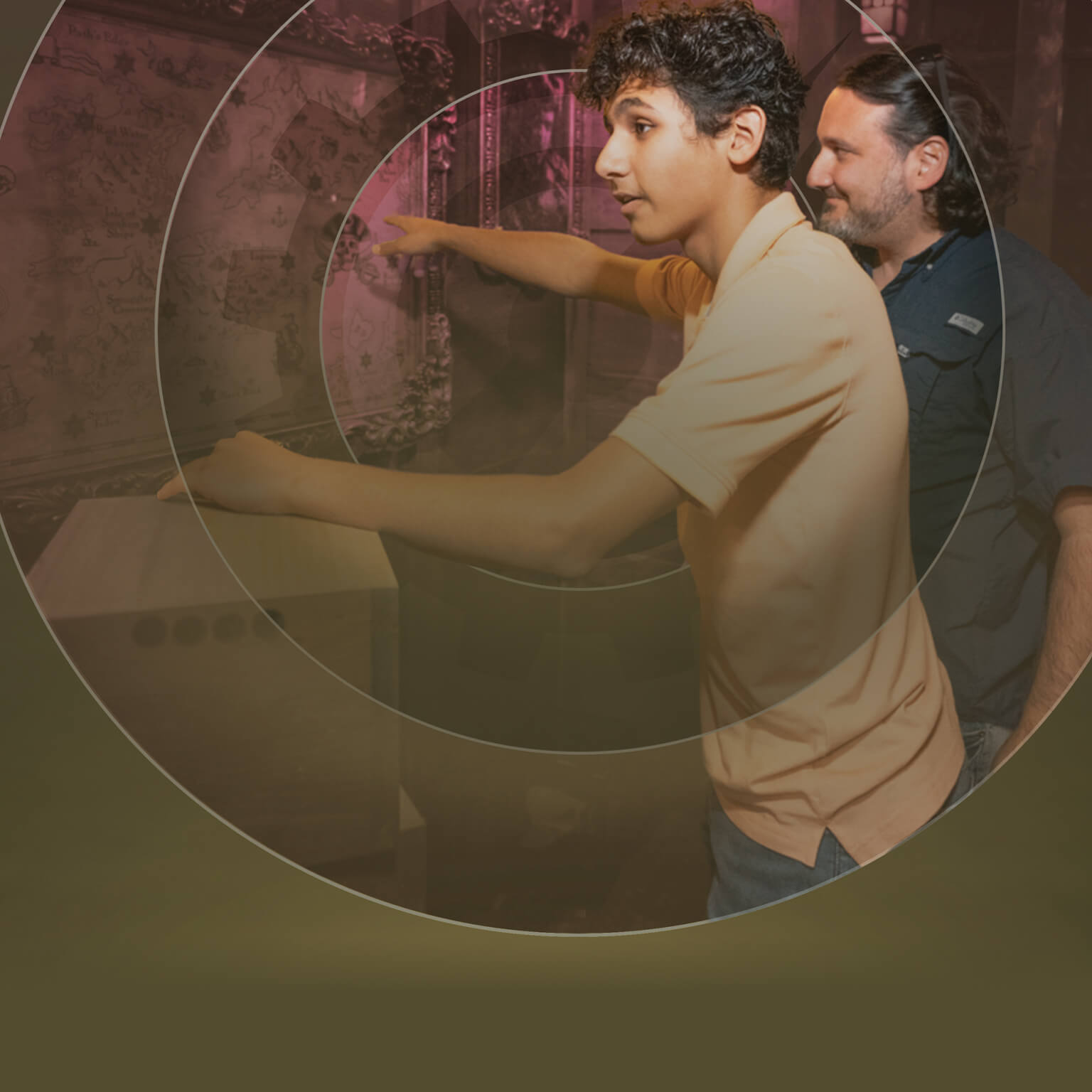 An image of father and son trying to solve their way out of a pirate themed escape room with a circle design overlay.