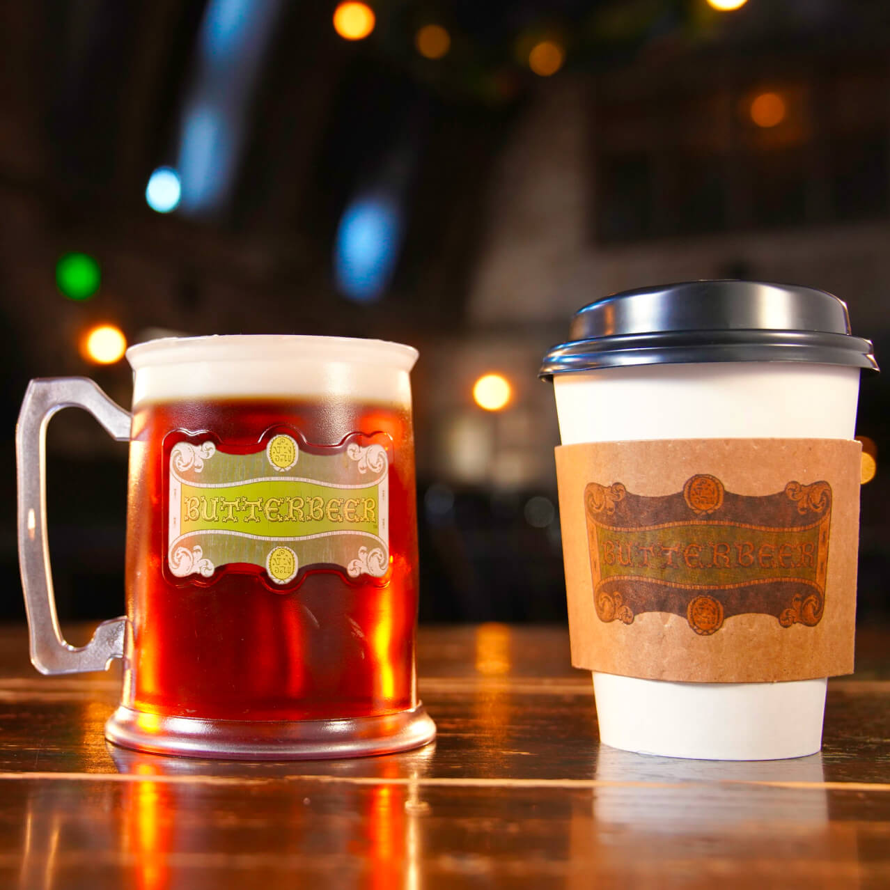 A frozen Butterbeer™, a cold Butterbeer™ in a souvenir mug and a hot Butterbeer™ cup with a lid.