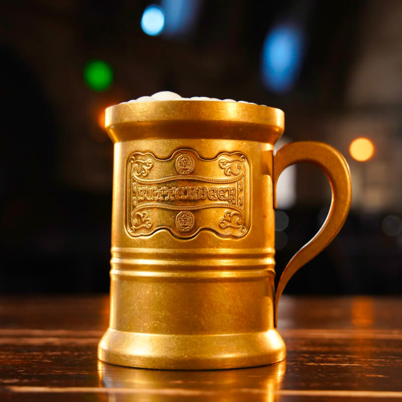 Up-close shot of a Butterbeer™ golden stein.