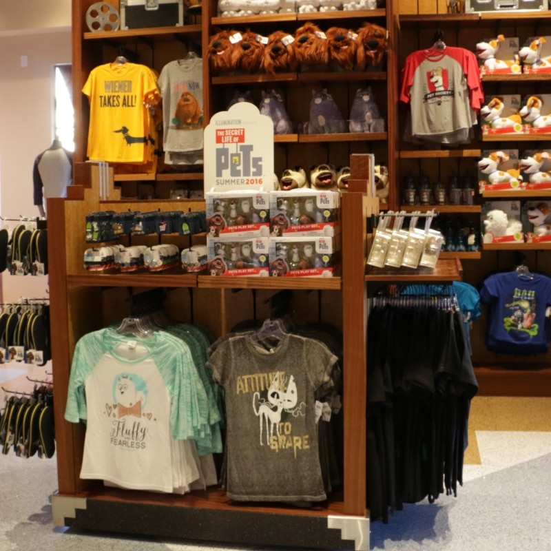Clothing racks with shirts in a souvenir store.