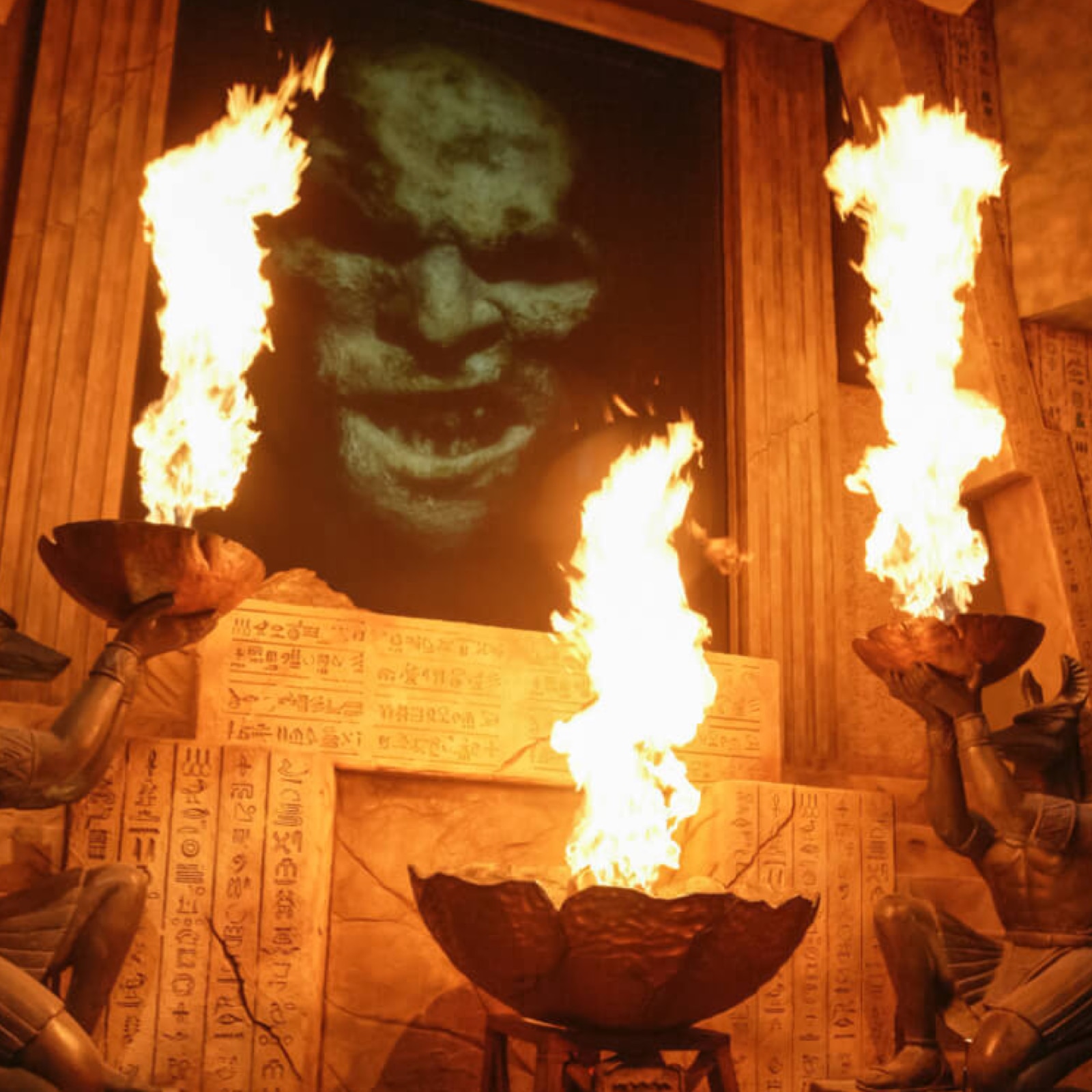 The mummy's face on a fire lit wall.