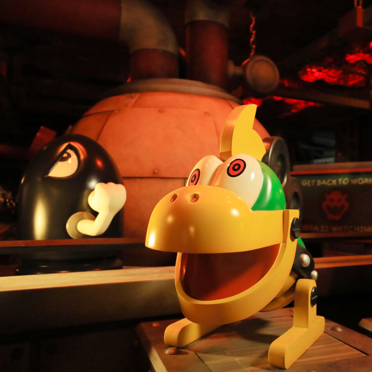 A Mecha Koopa and a Bullet Bill sit on display in Bowser's Castle.