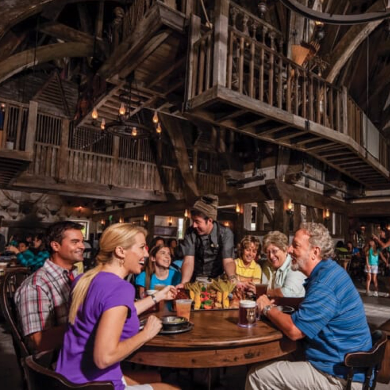 People eating inside at Three Broomsticks.