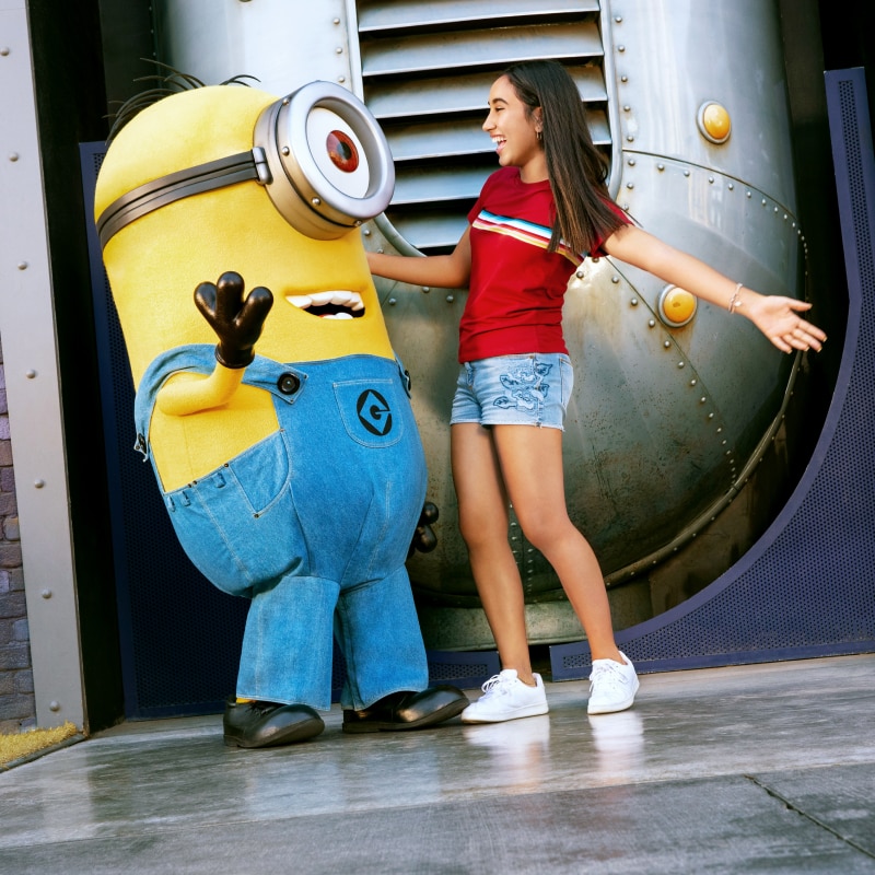 Minion standing with a girl
