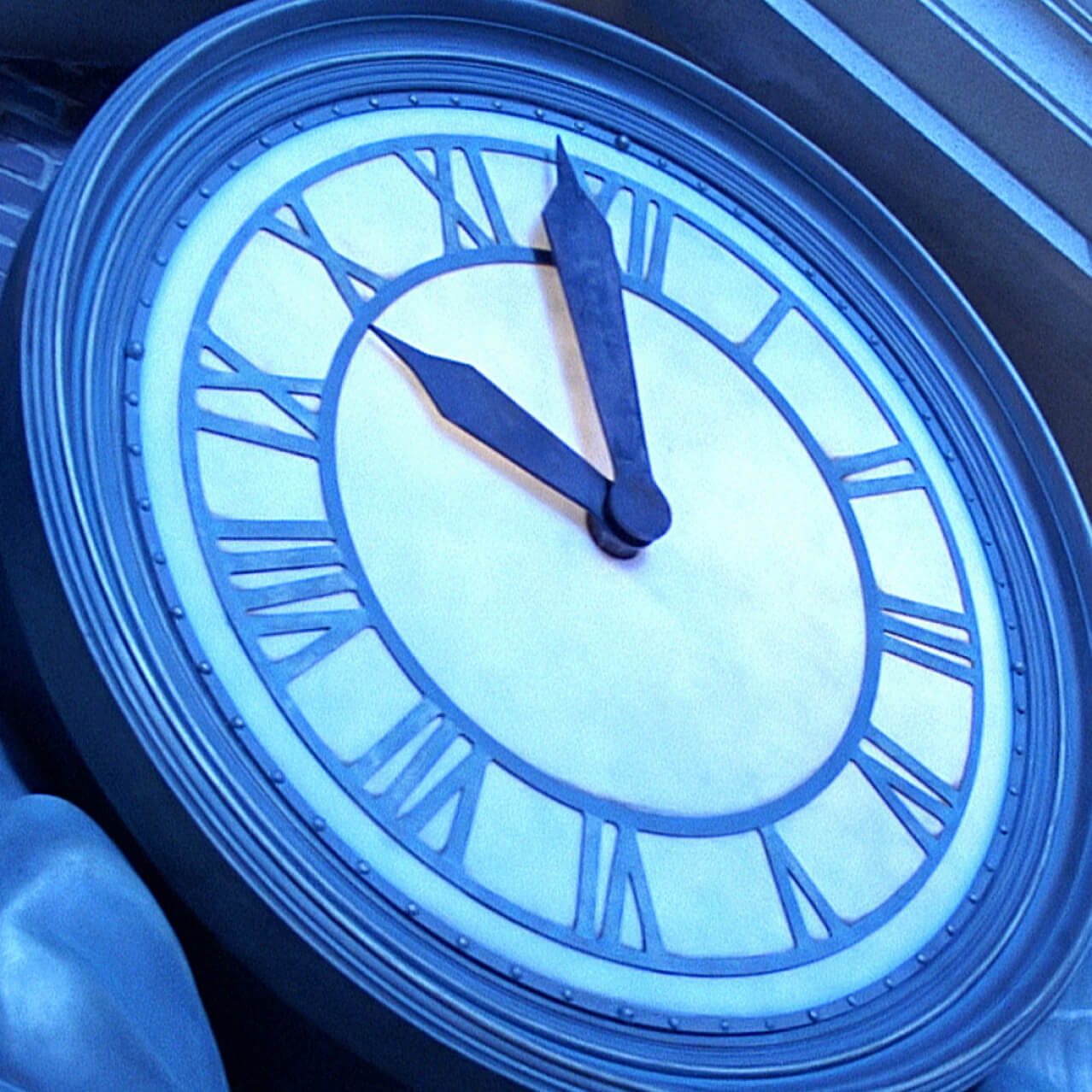 A close up of the Courthouse Square clock from Back to the Future.
