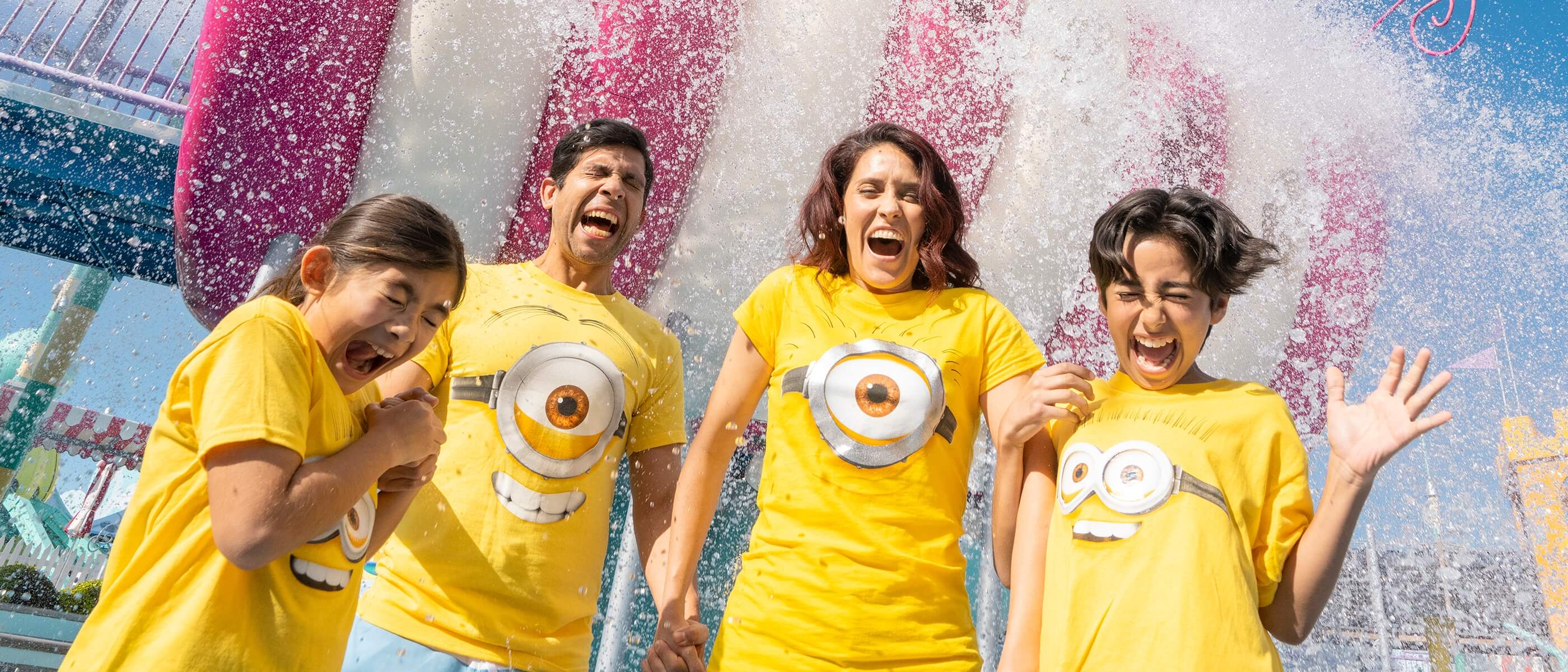 A family screaming with excitement as water pours over their heads in Super Silly Fun Land at Universal Studios Hollywood.